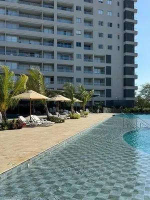 a hotel with a swimming pool and a building at Santa Marina Caribbean Dreams in Santa Marta