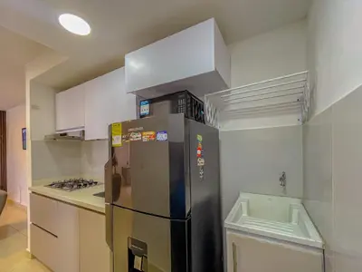 a kitchen with a stainless steel refrigerator and a stove at View 17, Modern, 5 min from Rafael Nuñez Airport in Cartagena de Indias