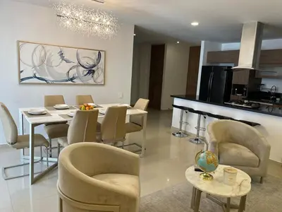 a kitchen and dining room with a table and chairs at Luxury Apartment in Great Area! in Barranquilla