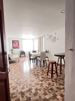 a living room with a table and chairs at Amoblados Cartagena, El Laguito in Cartagena de Indias