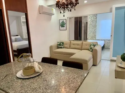 a living room with a couch and a table at Amoblados Cartagena, El Laguito in Cartagena de Indias