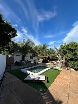 a backyard with a swimming pool and grass at House Las Palmas villa privada in Puerto Colombia