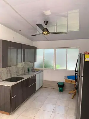 a kitchen with a ceiling fan and some windows at House Las Palmas villa privada in Puerto Colombia