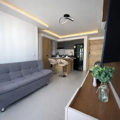 a living room with a couch and a table at Despierta con vista al mar en el corazón de CTG in Cartagena de Indias