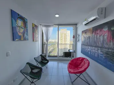 a room with chairs and a window with a view at Cartagena Relax in Cartagena de Indias