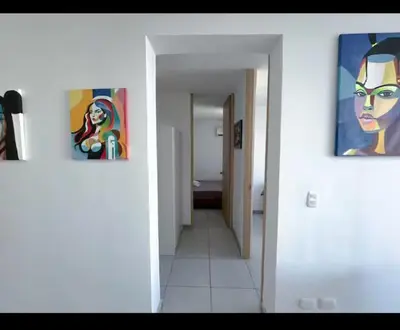 a hallway with two paintings on the walls of a bathroom at Cartagena Relax in Cartagena de Indias