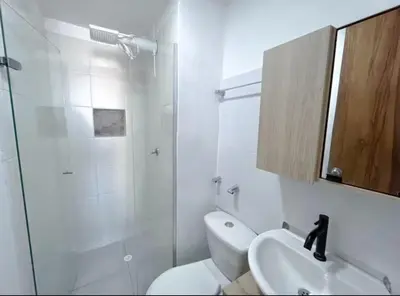 a bathroom with a toilet and a sink and a shower at Cartagena Relax in Cartagena de Indias