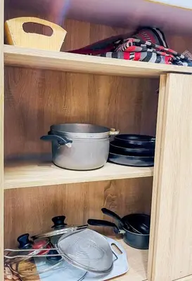 a wooden shelf with pots and pans on it at Business Stay More30Days Fast WiFi Premium Comfort in Cartagena de Indias