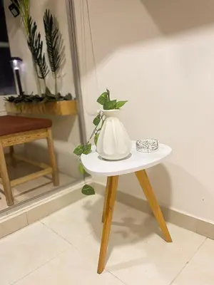 a white vase sitting on a small table at Business Stay More30Days Fast WiFi Premium Comfort in Cartagena de Indias