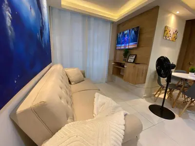 a living room with a couch and a tv at Premium stay in a central area with parking in Cartagena de Indias