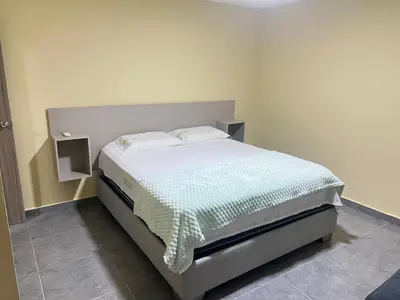 a bedroom with a bed in a room at Nora la bella in Barranquilla