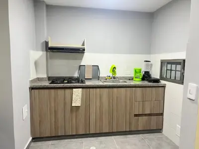 a kitchen with a sink and a counter top at Nora la bella in Barranquilla