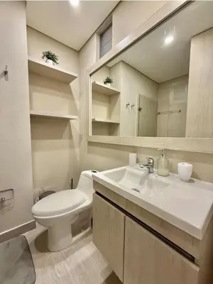 a bathroom with a sink and a toilet and a mirror at Luxury Ocean View Aparment in Cartagena de Indias