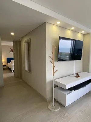 a living room with a television on a wall at Luxury Ocean View Aparment in Cartagena de Indias
