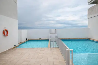 a swimming pool with blue water in a building at walled city of Cartagena 20 in Cartagena de Indias