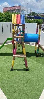 a playground with a colorful play structure on the grass at Apartamento en Torices Piso 24 - Cartagena - Playa cerca al Mar in Cartagena de Indias