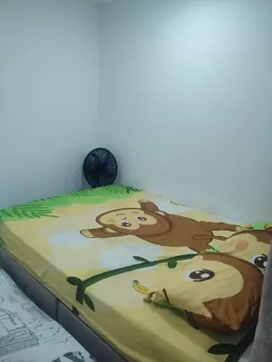 a bed with a painting of a monkey on it at Sagitario hospedaje in Cartagena de Indias