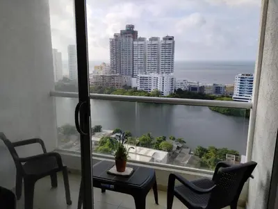 a room with a balcony with a view of the ocean at New Apartment Frente al Mar, Cerca Getsemani in Cartagena de Indias