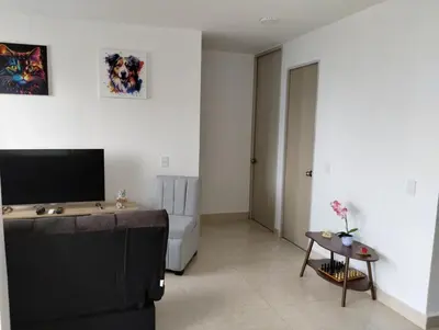 a living room with a couch and a television at New Apartment Frente al Mar, Cerca Getsemani in Cartagena de Indias