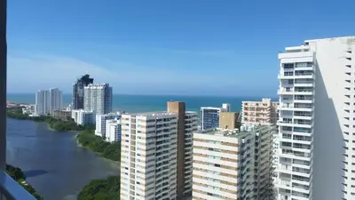 a city with tall buildings and a river at Apartamento cerca al Mar y a el Centro Histórico in Cartagena de Indias