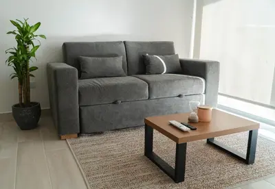 a living room with a couch and a coffee table at Loft Privado , Sunset y armonia in Santa Marta