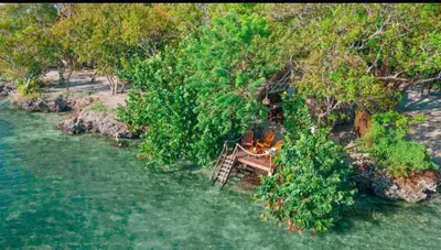 an aerial view of a park with trees and a bench at Eco Hotel Islabela Deluxe in Isla Grande