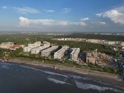 an aerial view of a beach with white buildings at MarNilo House Serena del Mar Cartagena in Cartagena de Indias