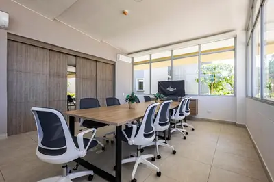 an office with a long table and chairs at MarNilo House Serena del Mar Cartagena in Cartagena de Indias