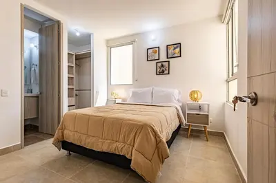 a bedroom with a large bed in a room at MarNilo House Serena del Mar Cartagena in Cartagena de Indias