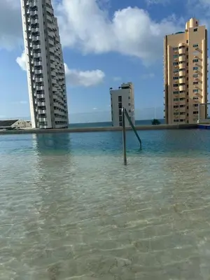 a pole in the water in front of some buildings at Espectacular apartamento vista al centro y al Mar in Cartagena de Indias