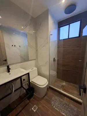 a bathroom with a shower and a toilet and a sink at Edificio Shanty- Easy Rents Sas in Barranquilla