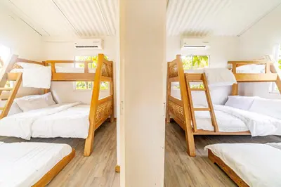 a group of bunk beds in a room at Quinta del Mar El Paraiso in Tolú