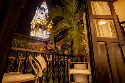 a balcony with a building with a clock tower at Casa de Alba Hotel Boutique in Cartagena de Indias