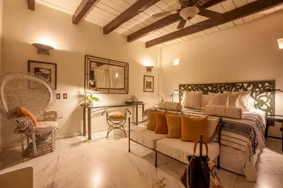 a bedroom with a bed and a couch at Casa de Alba Hotel Boutique in Cartagena de Indias
