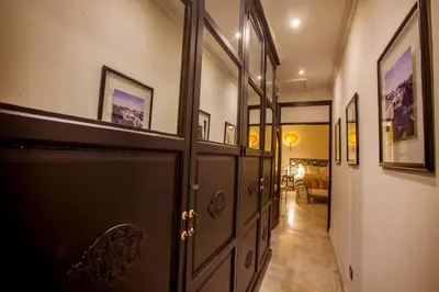 a hallway with a door and a room with a couch at Casa de Alba Hotel Boutique in Cartagena de Indias