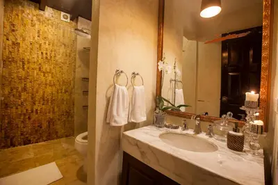 a bathroom with a sink and a mirror at Casa de Alba Hotel Boutique in Cartagena de Indias