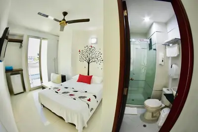 a bedroom with a bed with a tree on it at Hotel Florida Sincelejo in Sincelejo