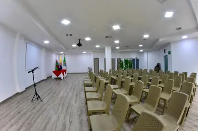 an empty room with chairs and a podium in it at Hotel Florida Sincelejo in Sincelejo