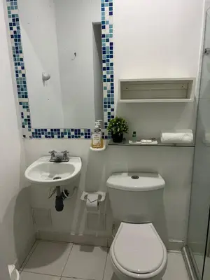 a small bathroom with a toilet and a sink at Hotel Fegali Art Boutique in Cartagena de Indias