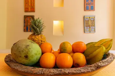 a bowl of fruit sitting on a table at Posada La Fe in Cartagena de Indias