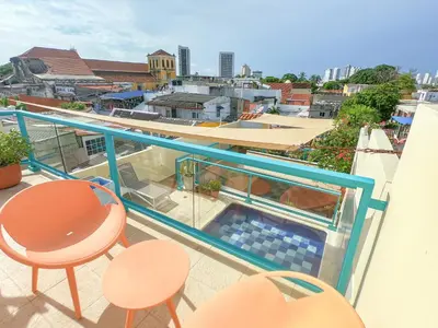 a balcony with a swimming pool on top of a building at Posada La Fe in Cartagena de Indias