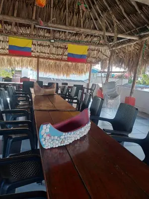 a long table with a pair of shoes sitting on it at Manzanillo Beach in Cartagena de Indias