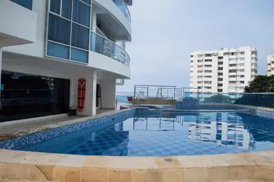a swimming pool in front of a building at Apartamento Vista Mar 1707 in Cartagena de Indias