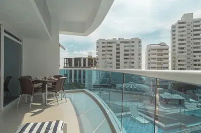 a balcony with a table and chairs on a building at Apartamento Vista Mar 1707 in Cartagena de Indias