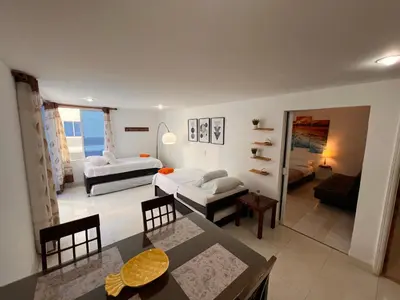 a living room with a couch and a table at Apartamento Nuevo Conquistador in Cartagena de Indias