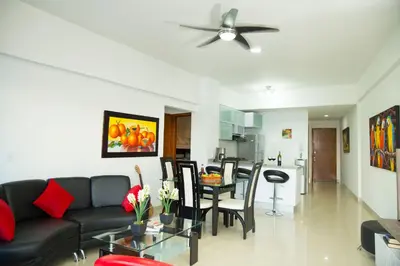 a living room with a couch and a table at Poseidon Lake Apartments in Cartagena de Indias