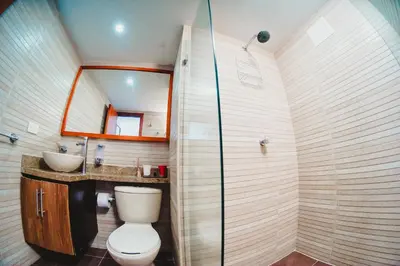 a bathroom with a toilet and a sink at Apartamento piso 12 y 17 Welch in Cartagena de Indias