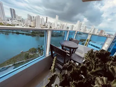 a balcony with a table and a view of the city at Cartagena El Laguito Apto cerca a la playa in Cartagena de Indias