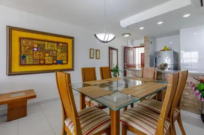 a dining room with a glass table and chairs at Cartagena - Torremarina in Cartagena de Indias