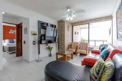 a living room with a leather couch and a living room at Cartagena - Torremarina in Cartagena de Indias